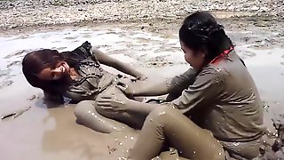 Two thai girls in mud