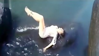 Wet Hot Indian Actress getting wet in sexy clothes in river