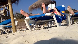 Brunettes candid feet at the beach