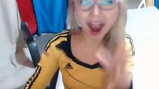 Nerdy blonde teen with braces toying