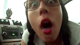 Amateur brunette schoolgirl in eyeglasses masturbating outdoors in her car