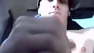 Teen boy jerking in a car on highway, cums and smiles