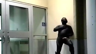 Barefoot frogman cums inside a condom in front of hotel doors