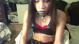 Ebony shemale in latex jerks by webcam