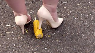 Crush-fetish. Thick legs in heels crushed the corn mercilessly.