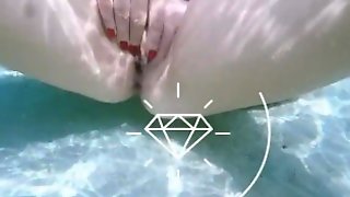 Girl solo masturbates underwater in sea