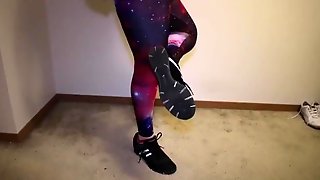 Sexy Girl in Shiny Leggings with Champion Sneakers