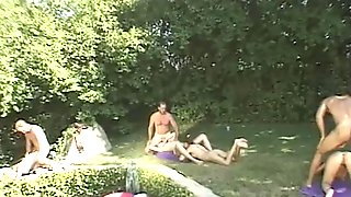 Horny babes and dudes in hardcore orgy by pool 