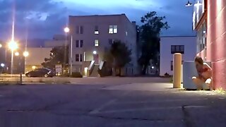 Depraved exhibitionist hot masturbates in the evening on the streets cities