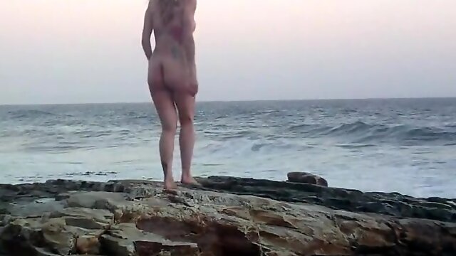 Naked in the beach