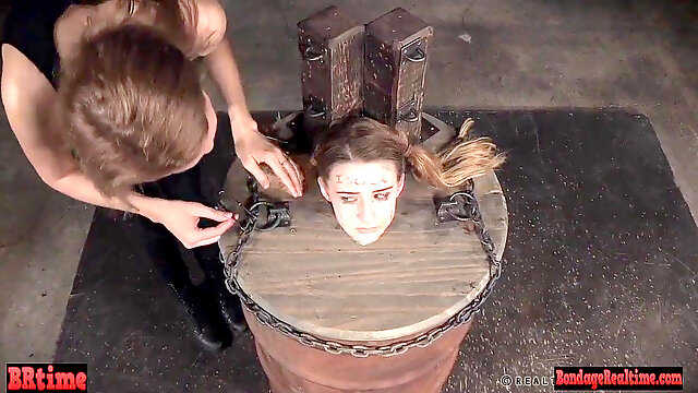 Domination & submission babe pent up in a barrel and electric