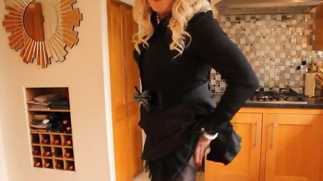 Sindy in black blous and pleated mii skirt 