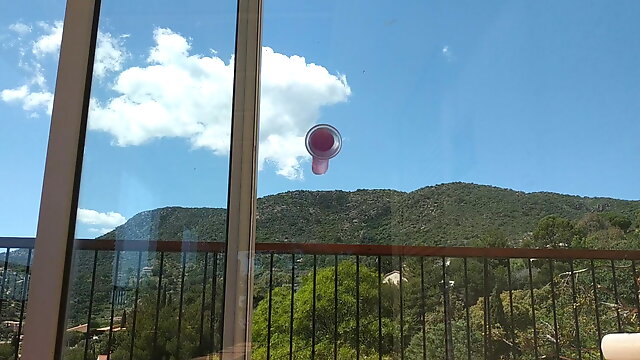 Suction cup dildo on balcony