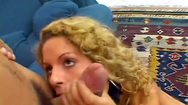 Larissa curly hair brazilian bottoms on a couch