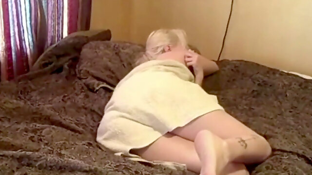 Blonde damsel farting wearing a towel