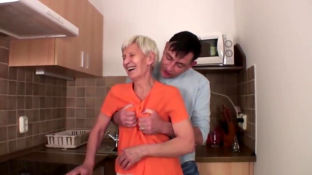 Hairy granny fucks with young guy in the kitchen