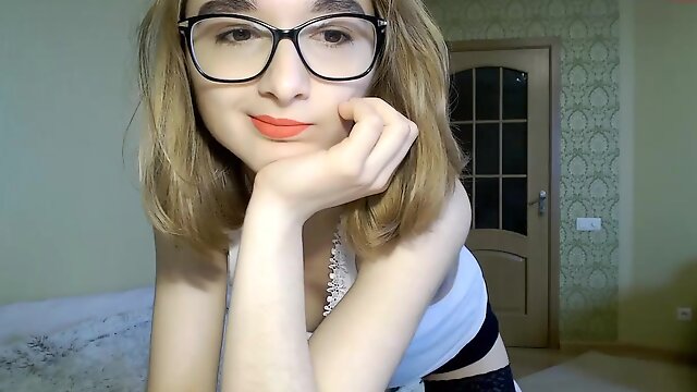 Cute teen Lina in glasses on webcam