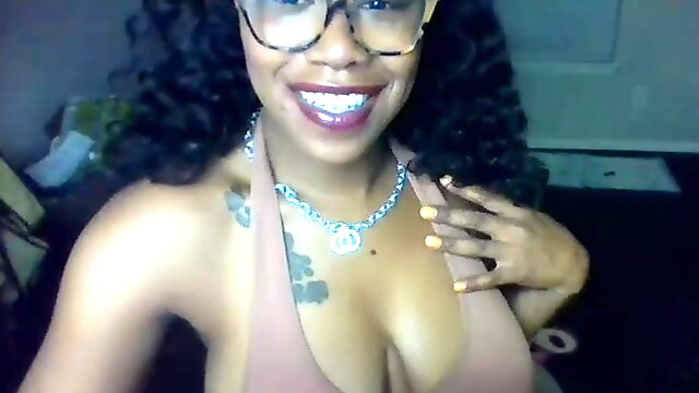 Busty Ebony drools on her big brown boobs