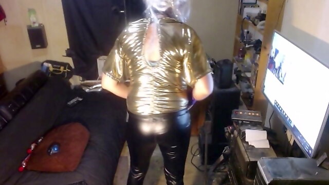 Tranny in gold bodysuit and black latex pants!