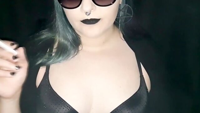Sexy smoking with black lipstick and sunglasses