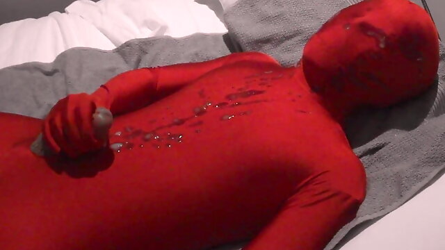 Red Zentai Twink Finishes Off Handjob