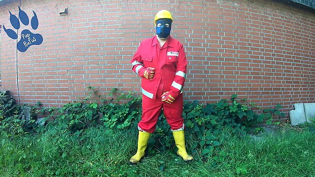 Worker Pup pawing off in red and yellow workgear