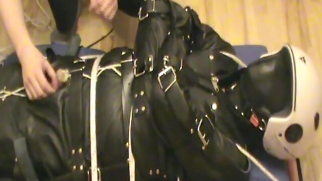 Restrained in a leahter insane sack