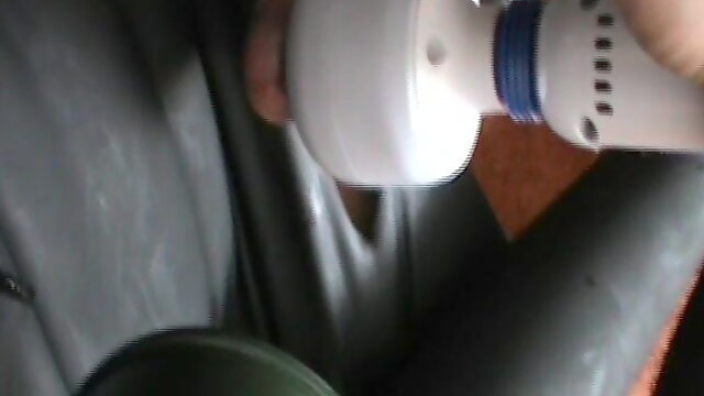 Rigidcuffed rubberslave is enjoyed