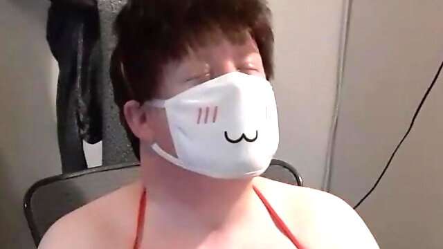 Chubby Crossdresser Playing with Wand in Bikini