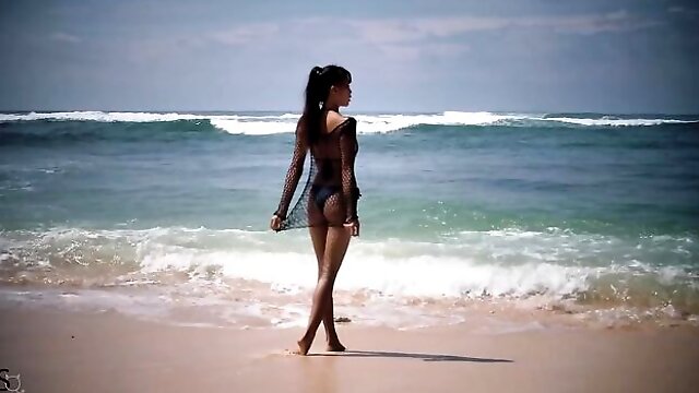 Cute Asian teen IyaQ shows off her godlike naked body on the beach