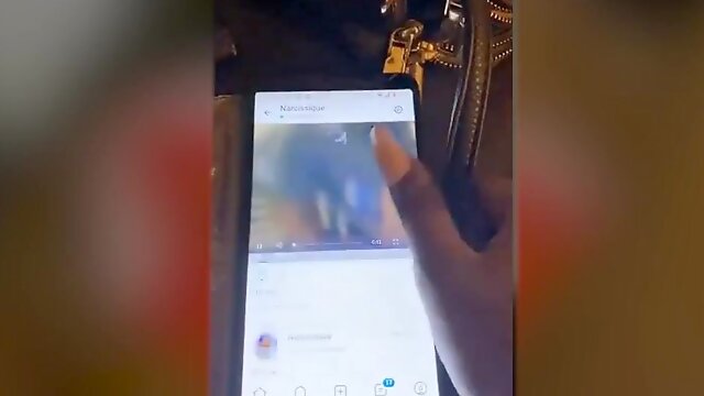 Girl Flashing Phone - Solo