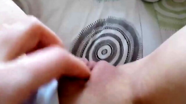 Rubbing her pink shaved pussy for me through her lingerie