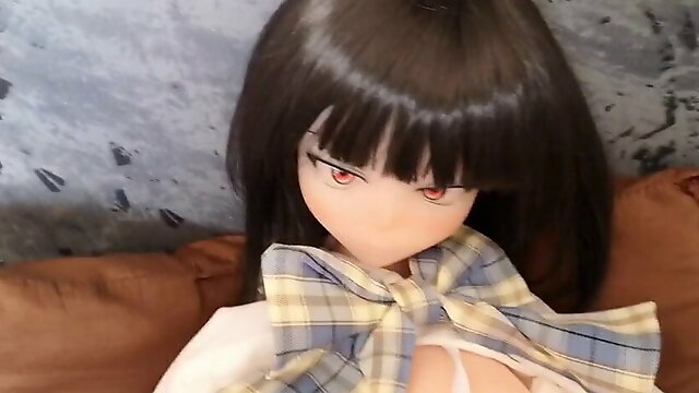 Mini doll in schoolgirl uniform gets fingered and squirts on the desk