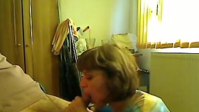 Hot mom giving blowjob to her young neighbor while hubby is at work