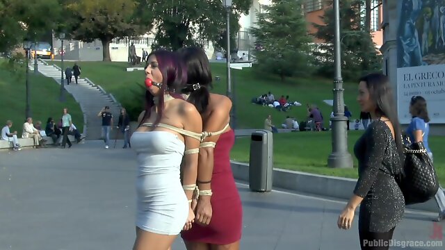 Coral Joice and Julia De Lucia tied up in public with ball gags