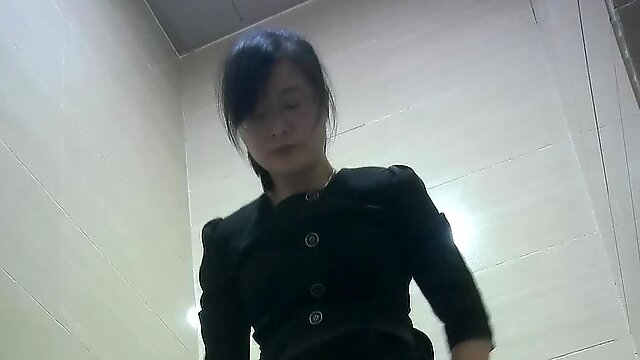 Chinese office milf lady pissing in the toilet