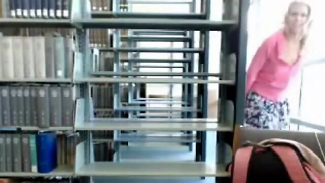 Horny blonde student masturbates in the library