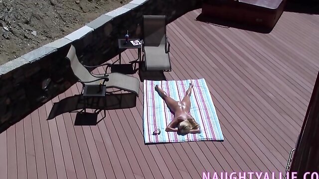 Big titties housewife sunbathing on her deck!