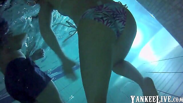 Underwater beautiful asses in the swimming pool