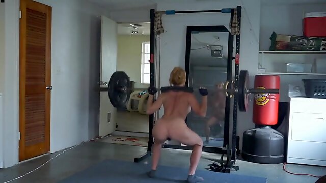 Ginger busty milf working naked in the gym