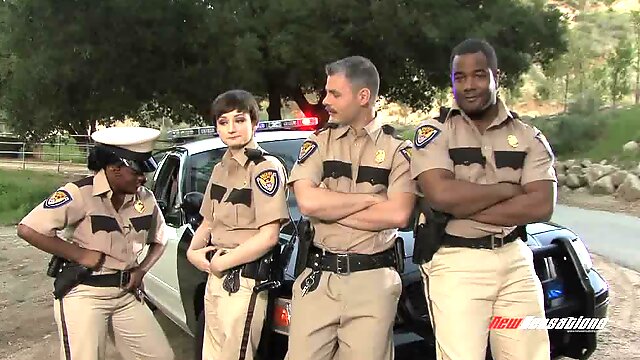 Pretty police woman attracted to a black male counterpart getting cozy at the station