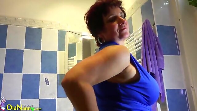 Mature pornstar masturbating with a massive dildo in the shower