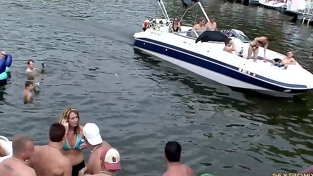 Party time on the lake has lots of topless amateur cuties
