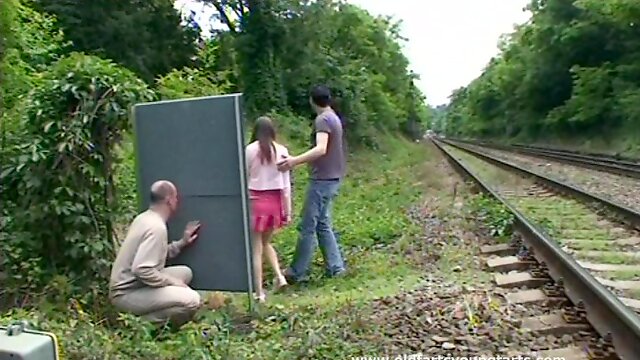A guy jerks off while watching a couple fucking outdoors