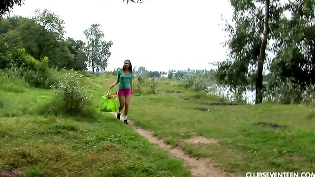 Teen solo model in shorts fingers her shaved coochie outdoors