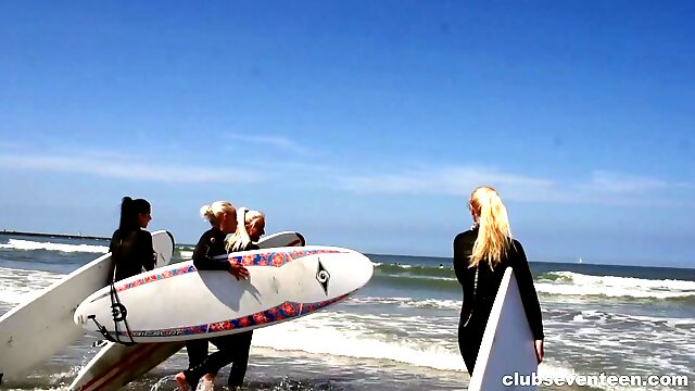 Four hot surfer girls eat pussy in the sand during a foursome