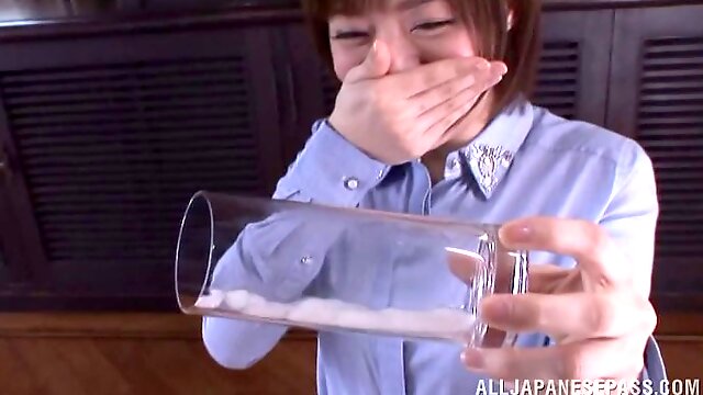 Asian milf sucks a cock and manages to milk it dry in a glass