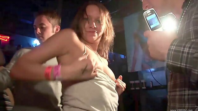 Crazy girls flash their bodies during a party in a club