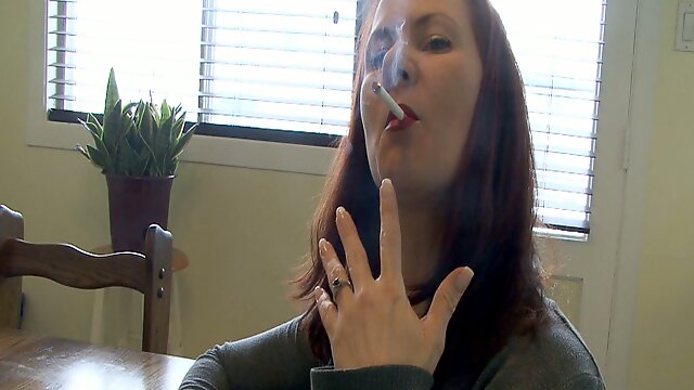 Behind the scenes clip with a redhead having a smoke