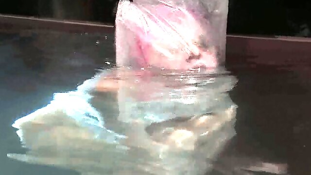 Cherry Torn the girl with pink hair in water bondage vid